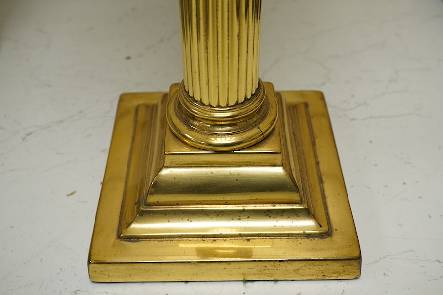 An Edwardian brass Corinthian columned oil lamp, 77cm high including funnel and shade. Condition - column good glass bowl, brass figments and funnel good, shade broken